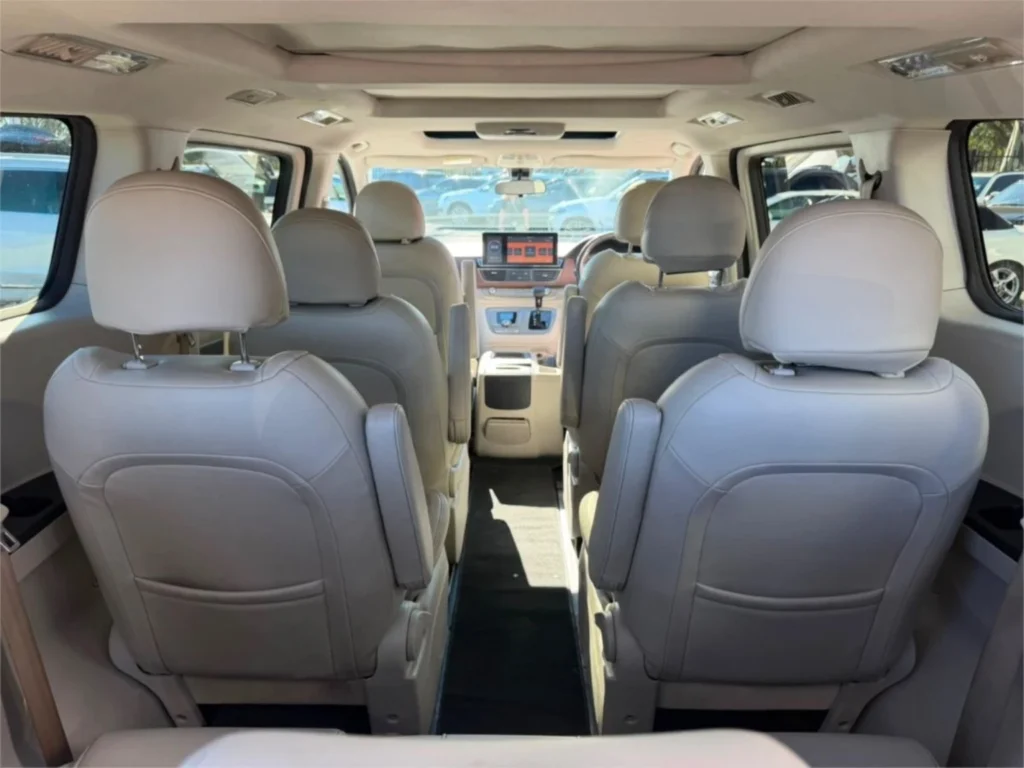 View towards the front of an LDV G10 Executive cabin, showing cream seats and the dashboard.